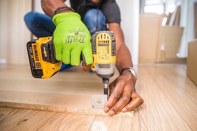 handyman using an electric hand drill